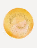 A circular watercolor wash in warm yellow, orange, and peach tones with scattered gold glitter specks, centered on a plain white background.