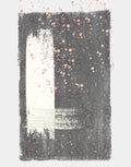 Abstract wall art print featuring a textured vertical composition with a dark charcoal gray background, a large off-white vertical block on the left, and scattered metallic-looking rose gold and gold speckles on a light gray background.