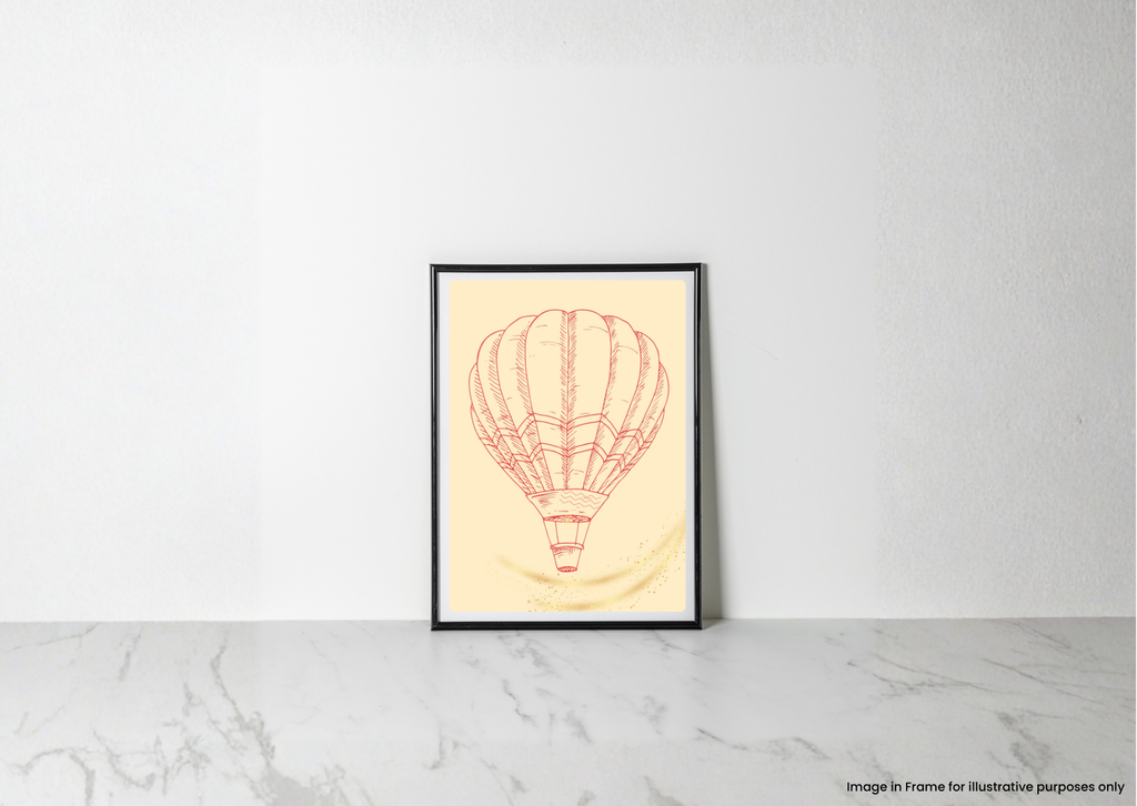 A framed art print featuring a red line drawing of a hot air balloon on a pale yellow background, leaning against a white wall on a light marble surface.