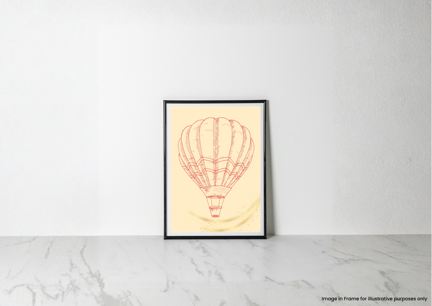 A framed art print featuring a red line drawing of a hot air balloon on a pale yellow background, leaning against a white wall on a light marble surface.