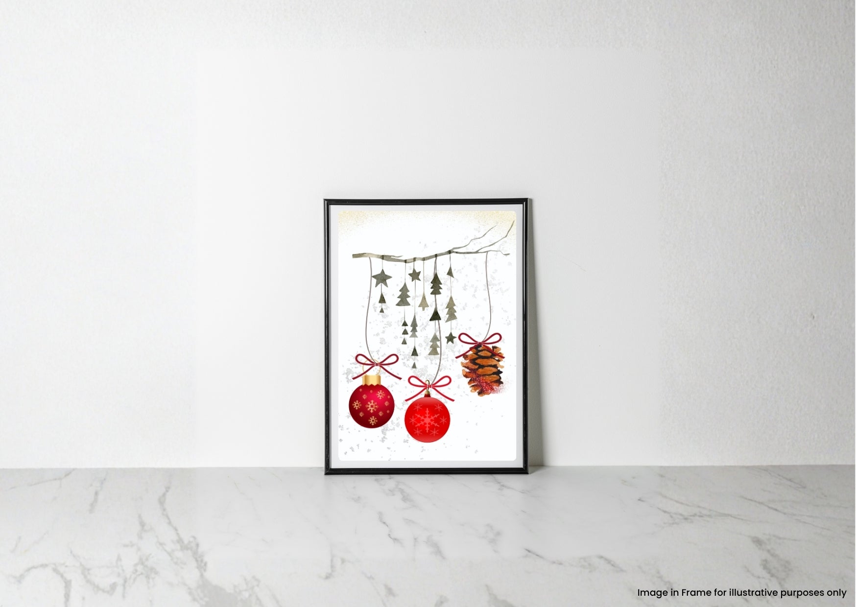 A framed art print featuring a watercolor illustration of red Christmas ornaments and pinecones hanging from a branch, displayed on a light marble surface against a white wall.