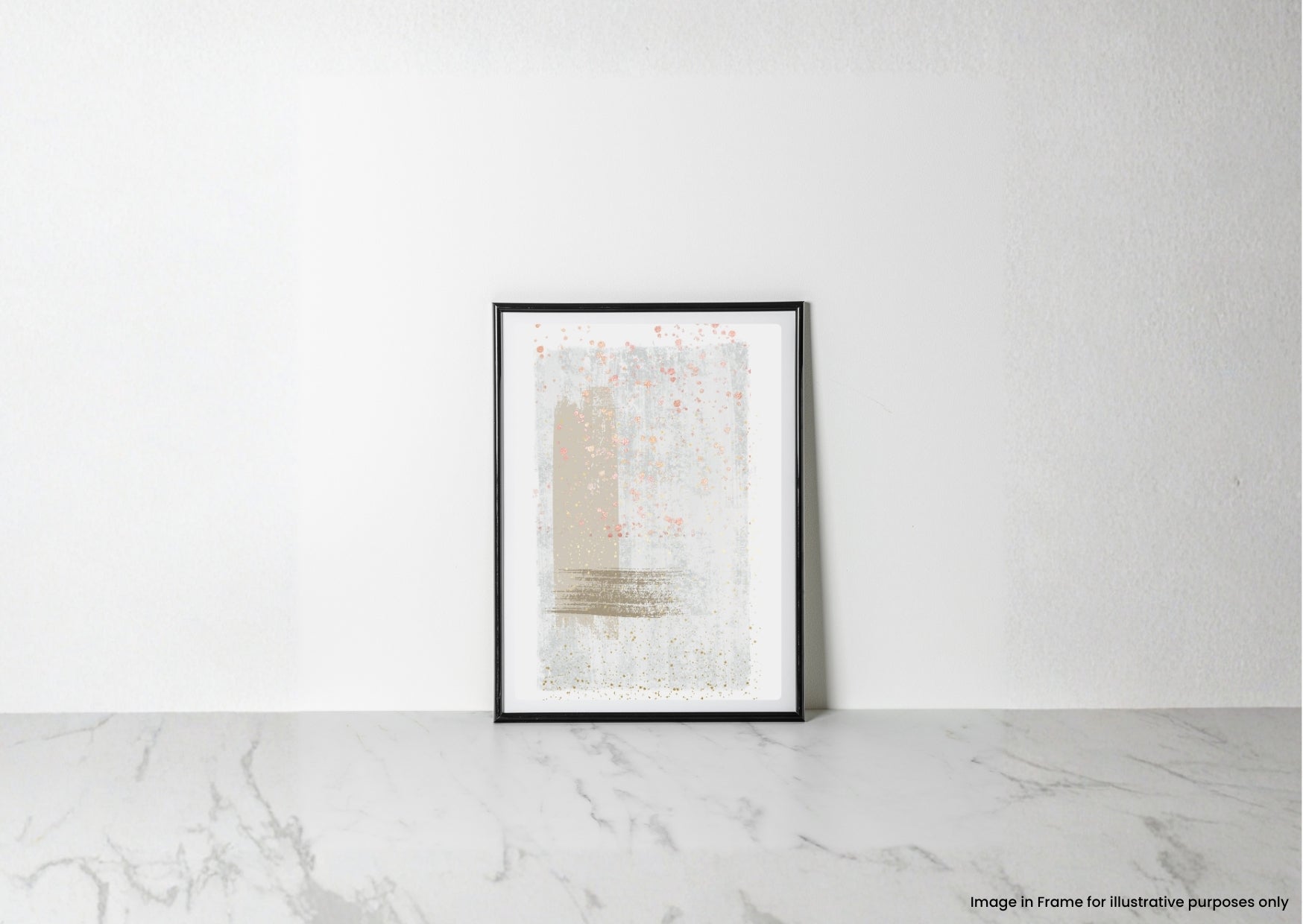 A framed abstract art print with soft beige, white, and gray brushstrokes and subtle pink speckles, displayed in a black frame leaning against a white wall on a light marble surface.
