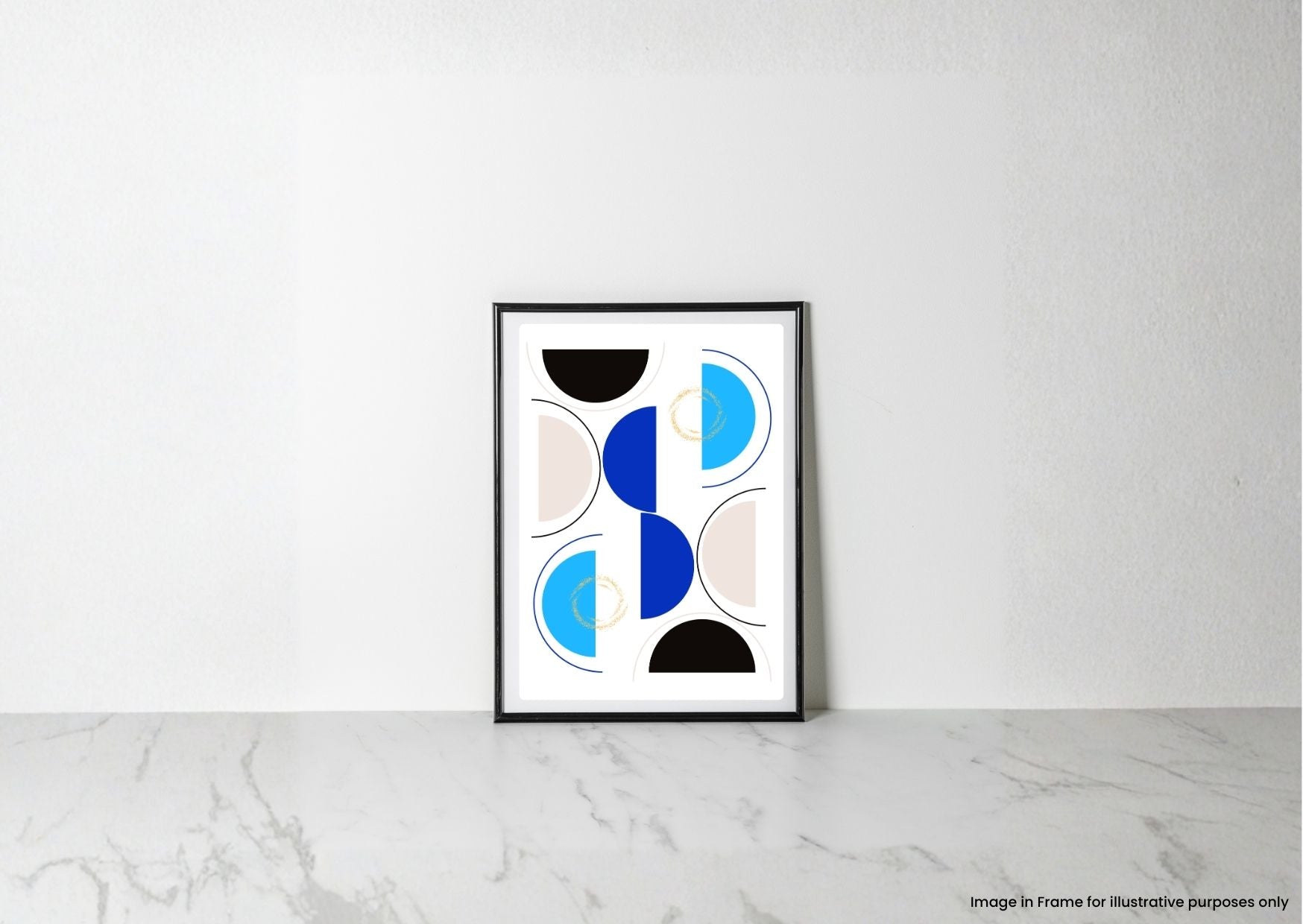 A framed abstract geometric art print with blue, black, and beige shapes on a white background, leaning against a white wall on a light marble surface.