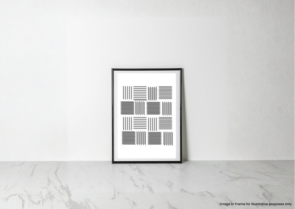 A framed minimalist black and white geometric art print leaning against a white wall on a light marble surface.