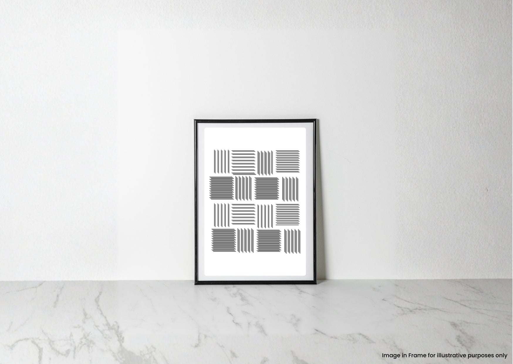 A framed minimalist black and white geometric art print leaning against a white wall on a light marble surface.