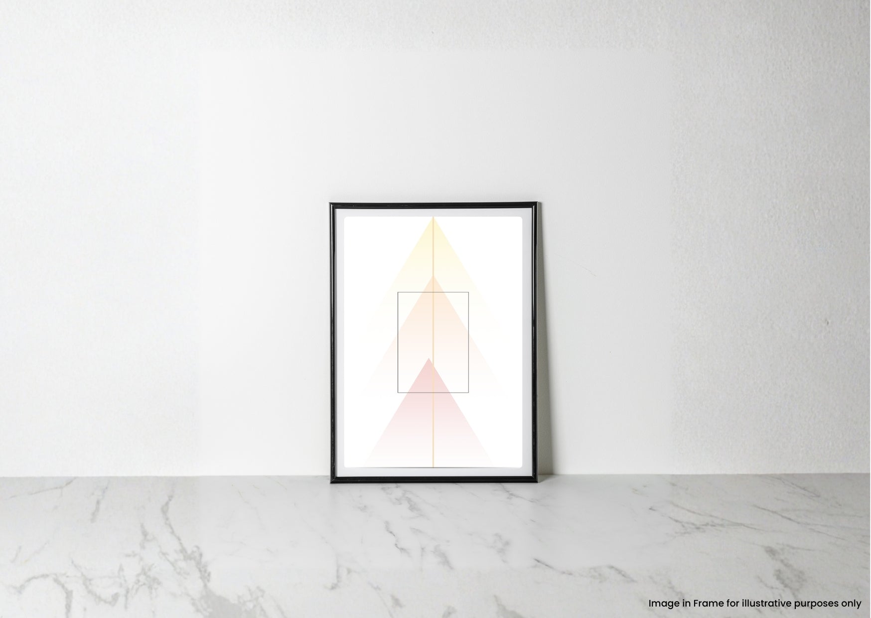 A minimalist framed art print with geometric pastel shapes in yellow, orange, and pink, displayed on a light marble surface against a white wall.