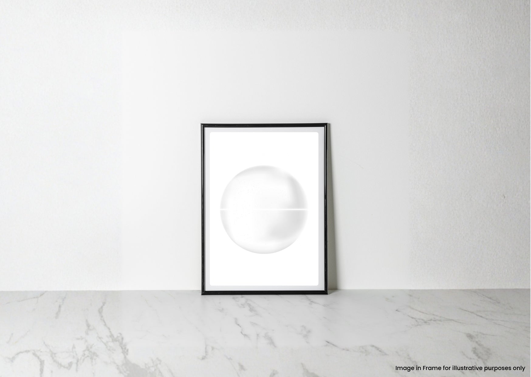 A minimalist black-framed art print featuring a white circular design, leaning against a white textured wall on a light gray marble surface.