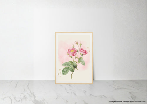 A framed botanical art print featuring pink roses with green leaves on a soft pink and cream background, leaning against a white wall on a light marble surface.