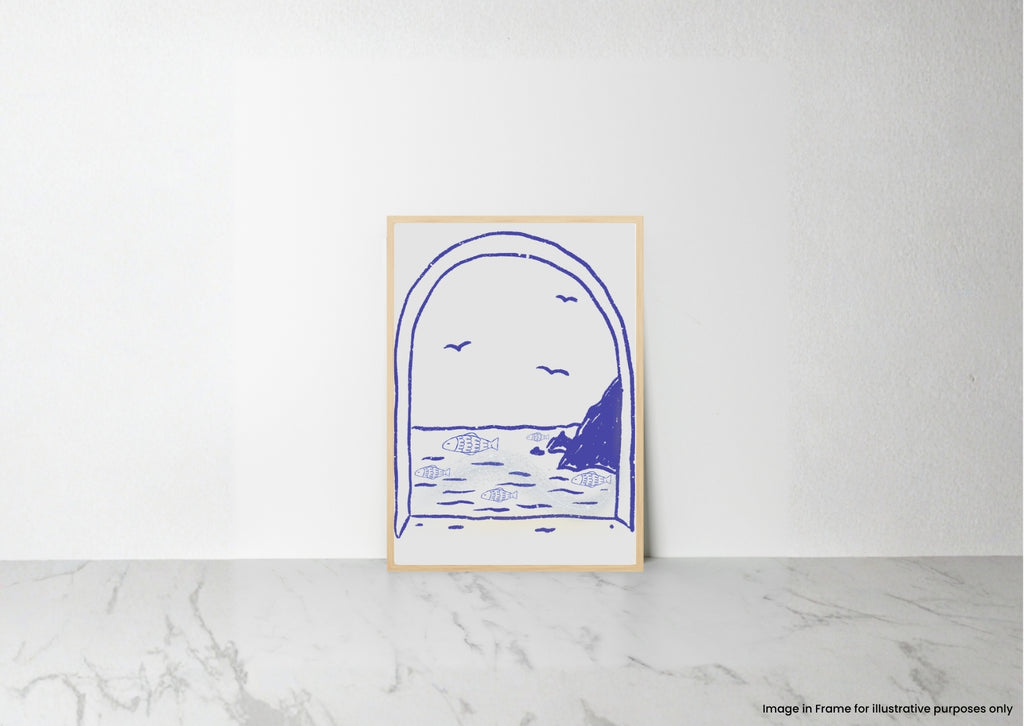 A minimalist art print featuring a blue line drawing of a coastal archway scene, displayed in a light wood frame on a white wall above a marble surface.