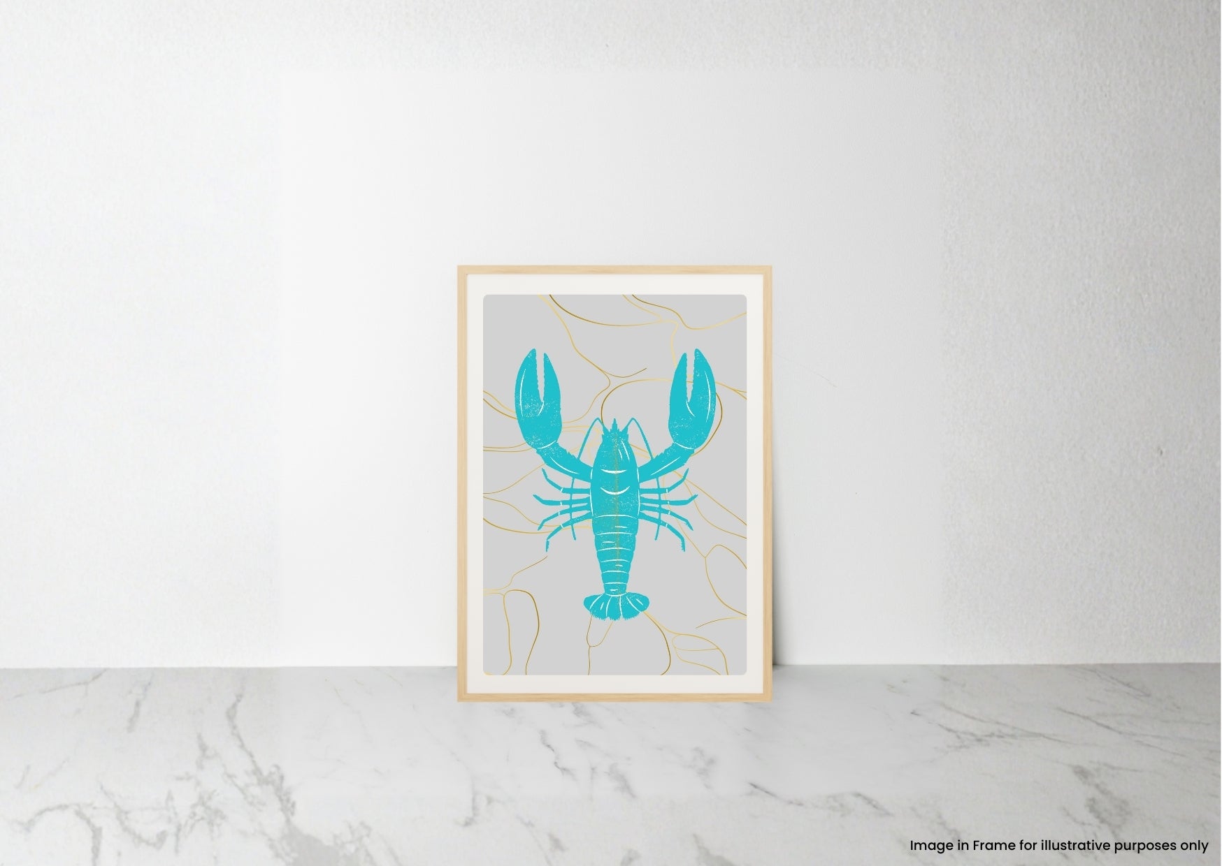 A framed art print featuring a turquoise lobster on a light gray background with thin gold line details, leaning against a white wall on a marble surface.