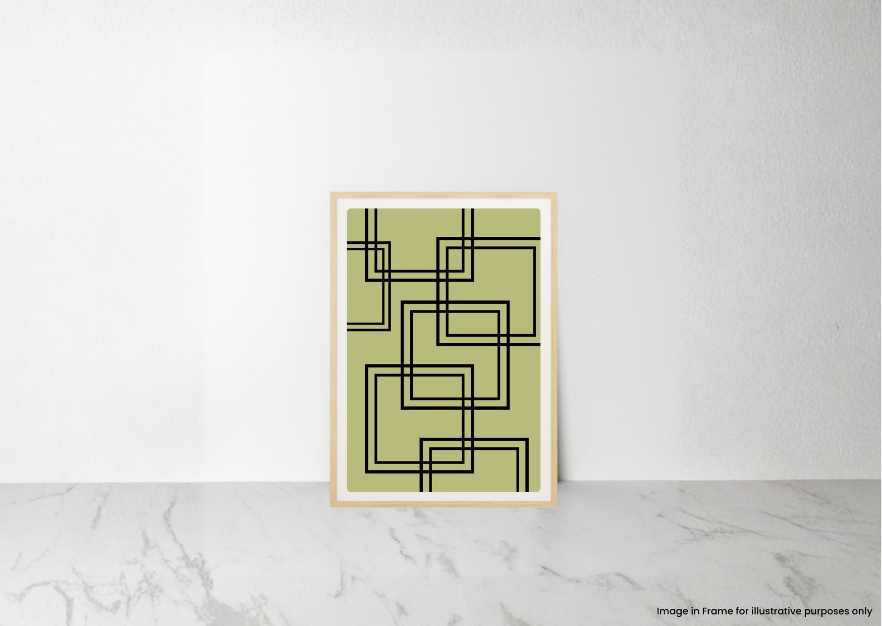 A framed abstract art print with black geometric lines on a muted olive green background, leaning against a white wall on a light marble surface.