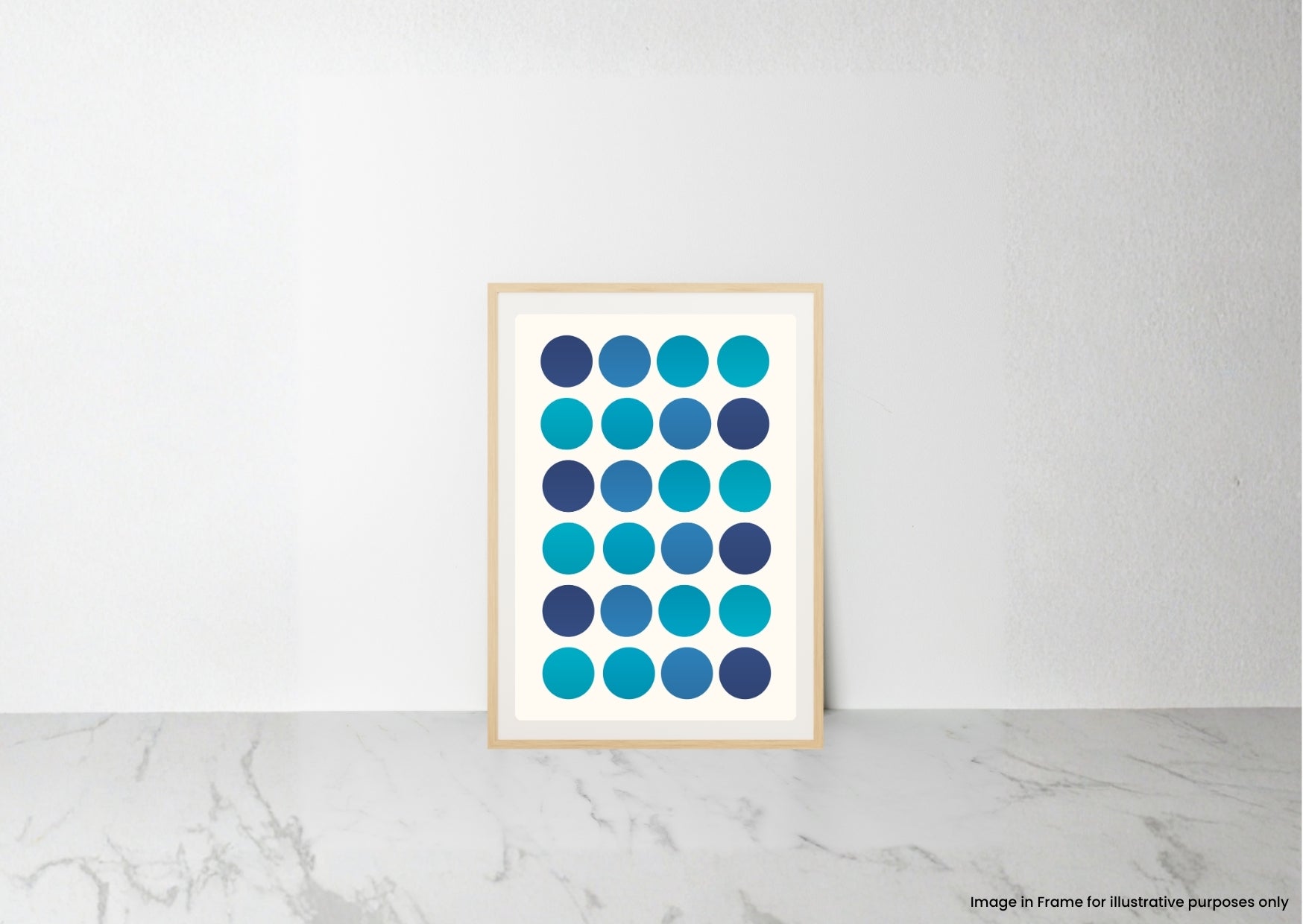 A framed art print featuring a grid of blue and teal circles, leaning against a white wall on a light gray marble surface.