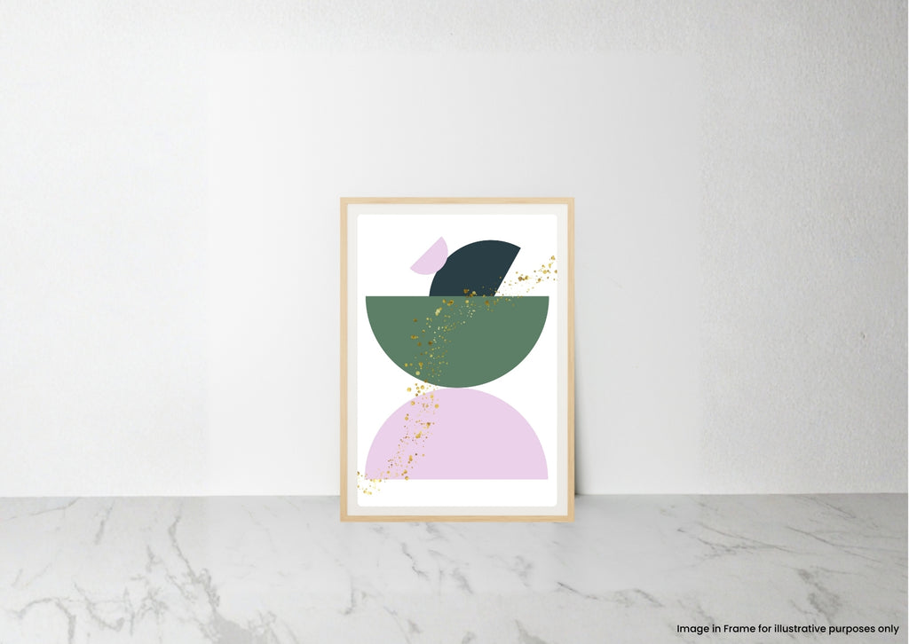 A framed abstract art print featuring geometric shapes in sage green, lavender, and black with delicate gold leaf accents, leaning against a white wall on a light gray marble surface.