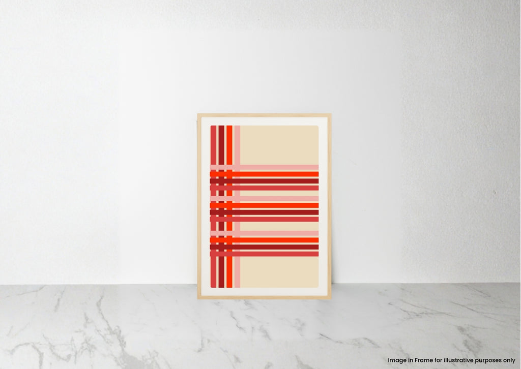 A framed abstract art print with red and orange horizontal stripes on a cream background, leaning against a white wall on a light marble surface.