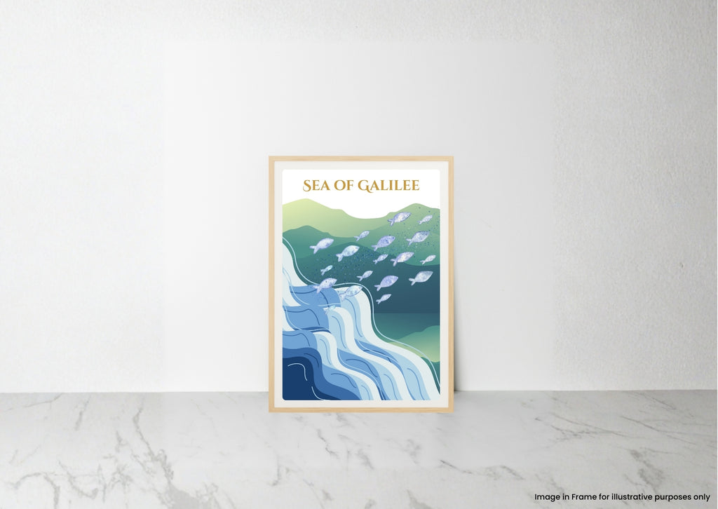 A framed art print titled 'SEA OF GALILEE' leaning against a white wall on a light marble surface. The print features a stylized illustration of blue and green waves with white fish, enclosed in a light wood frame.