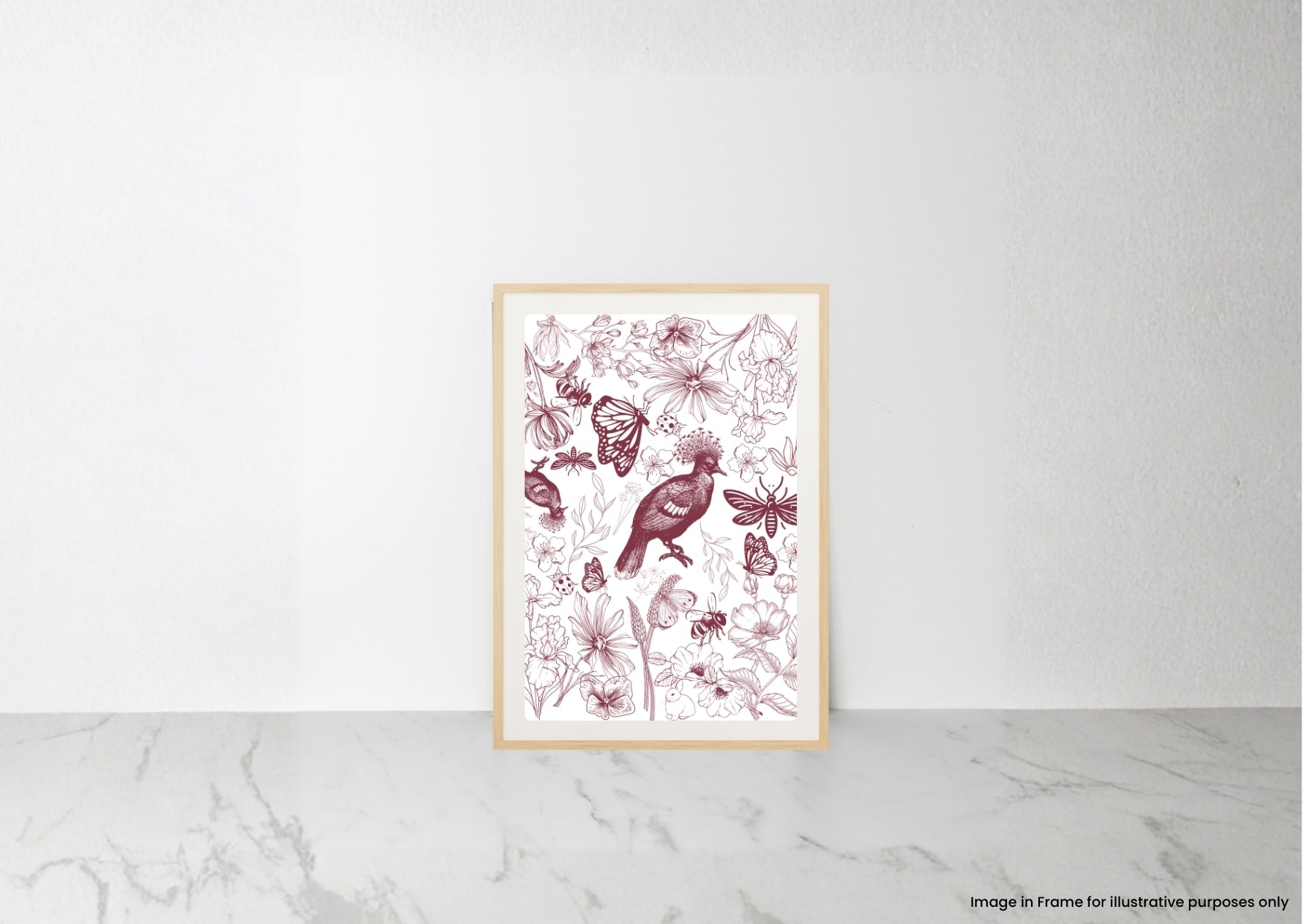 A framed botanical art print featuring a bird and butterflies in dusty rose and burgundy tones on a white background, displayed on a light marble surface against a white wall.