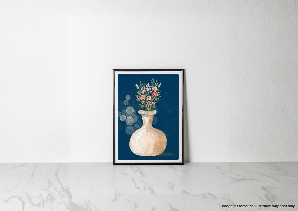 A framed art print featuring a watercolor-style beige vase with colorful wildflowers on a dark blue background, leaning against a white wall on a light marble surface.