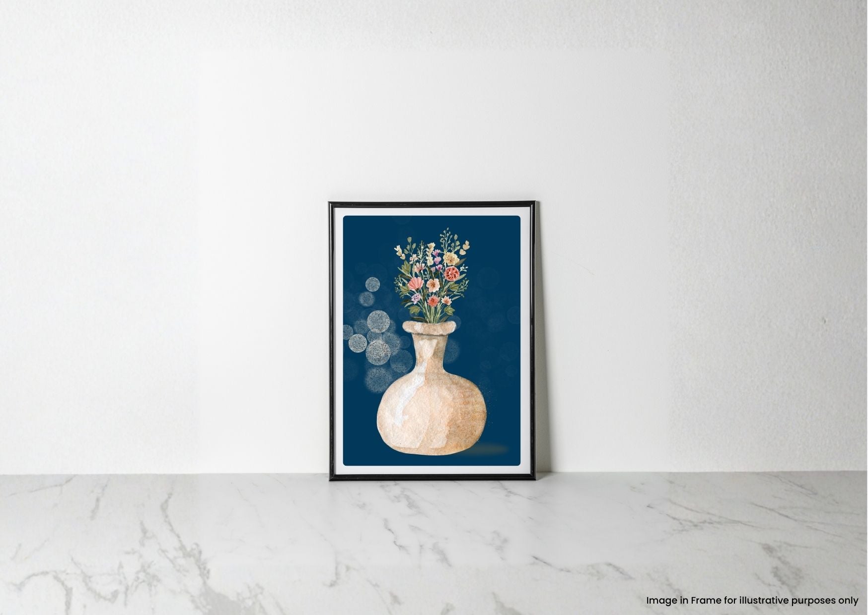 A framed art print featuring a watercolor-style beige vase with colorful wildflowers on a dark blue background, leaning against a white wall on a light marble surface.