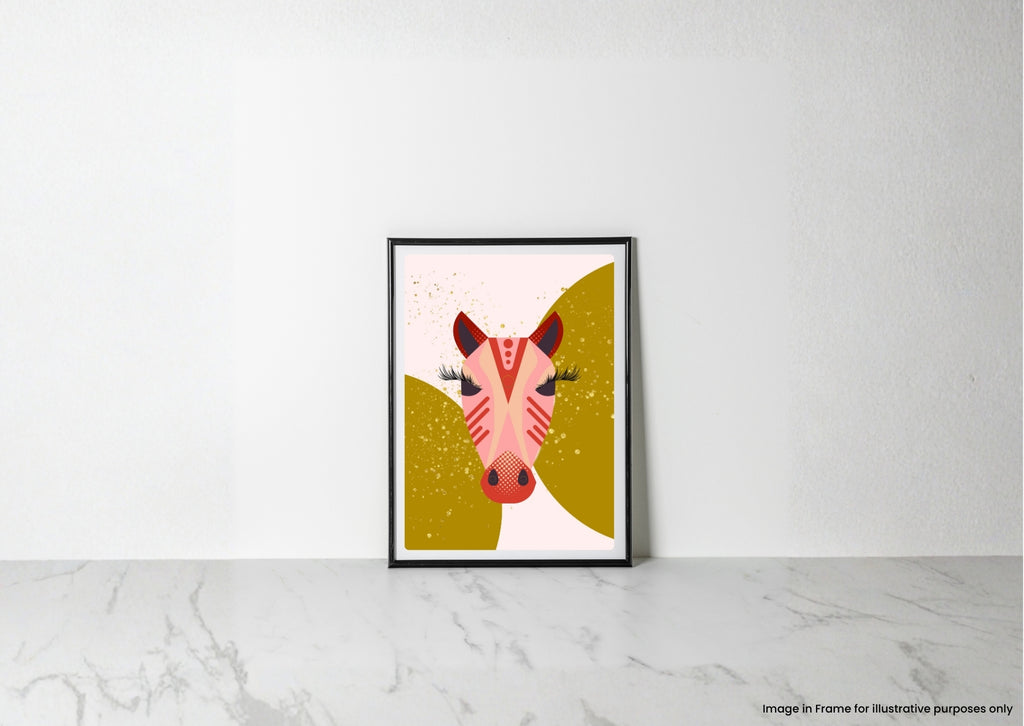 A framed art print featuring a stylized pink zebra head on a gold and white background, leaning against a white wall on a light marble surface.