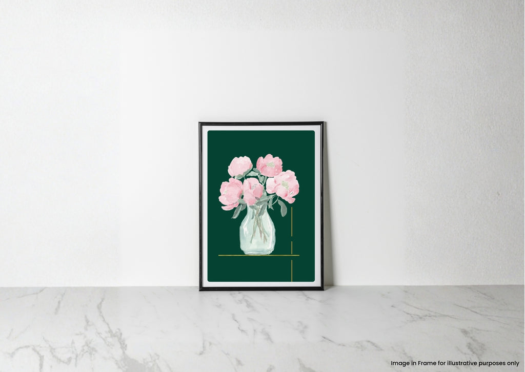 A framed art print featuring a watercolor illustration of pink peonies in a clear glass vase against a dark green background, leaning against a white wall on a light marble surface.