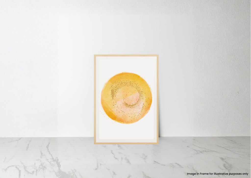 A minimalist framed art print featuring a textured yellow and orange circular watercolor design on a white background, leaning against a white wall on a light gray marble surface.