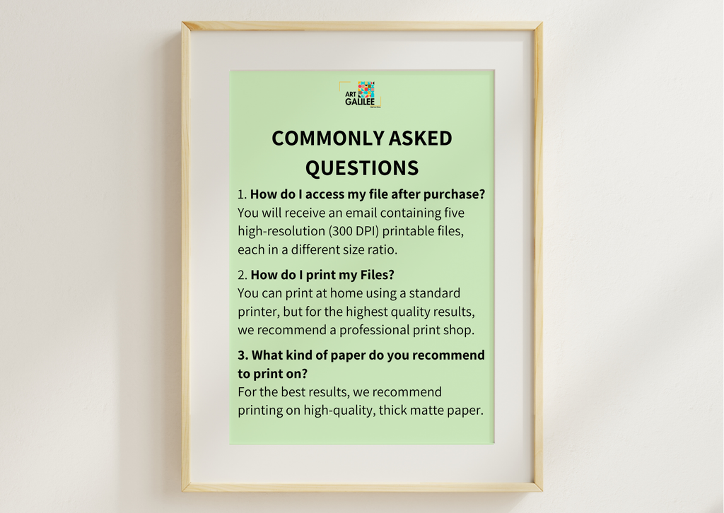 A framed informational poster titled 'COMMONLY ASKED QUESTIONS' with text about accessing and printing files, displayed against a light wall.