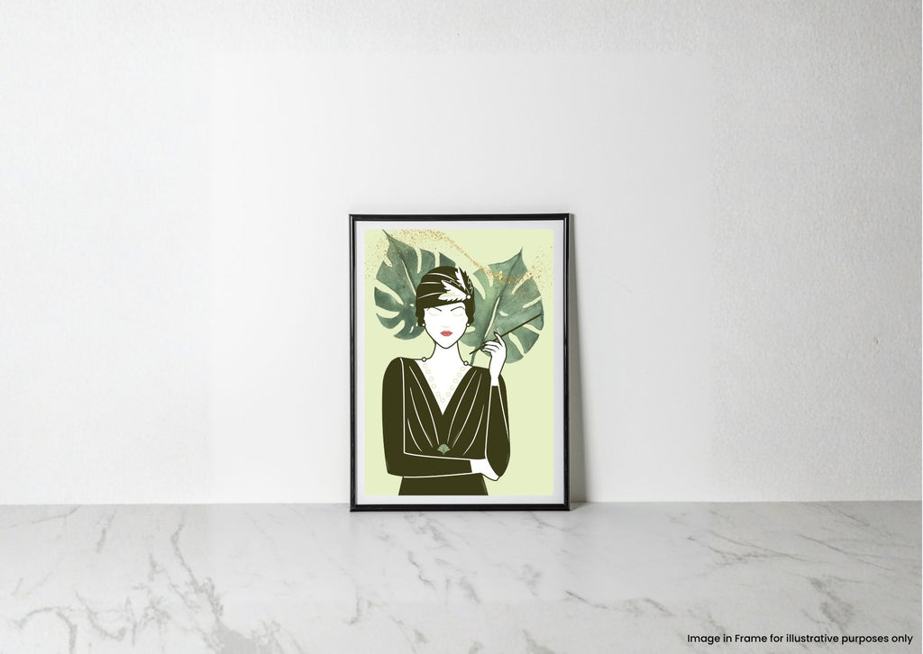 A framed art print featuring a minimalist 1920s flapper woman with green tropical leaves, leaning against a white wall on a light marble surface.