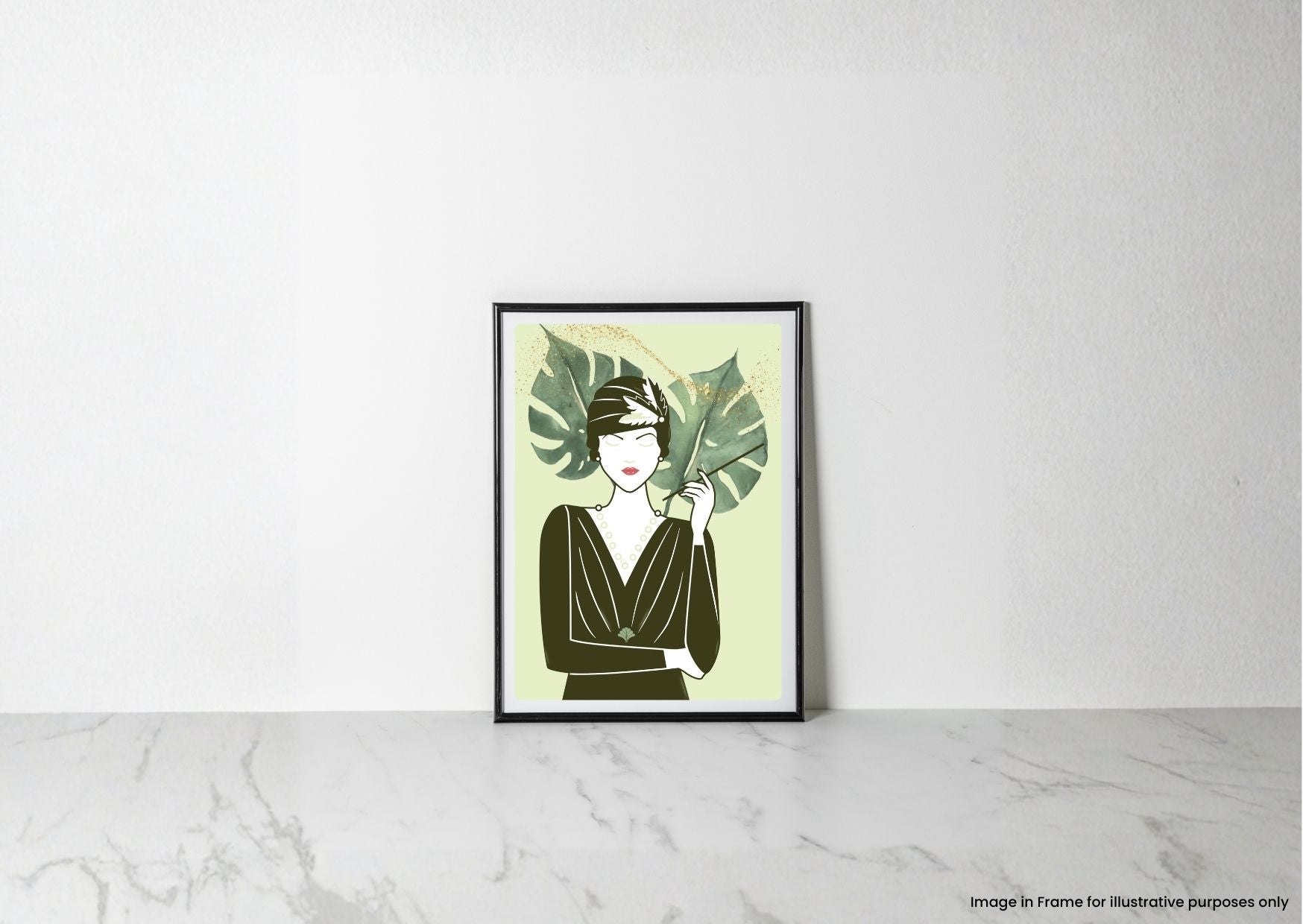 A framed art print featuring a minimalist 1920s flapper woman with green tropical leaves, leaning against a white wall on a light marble surface.